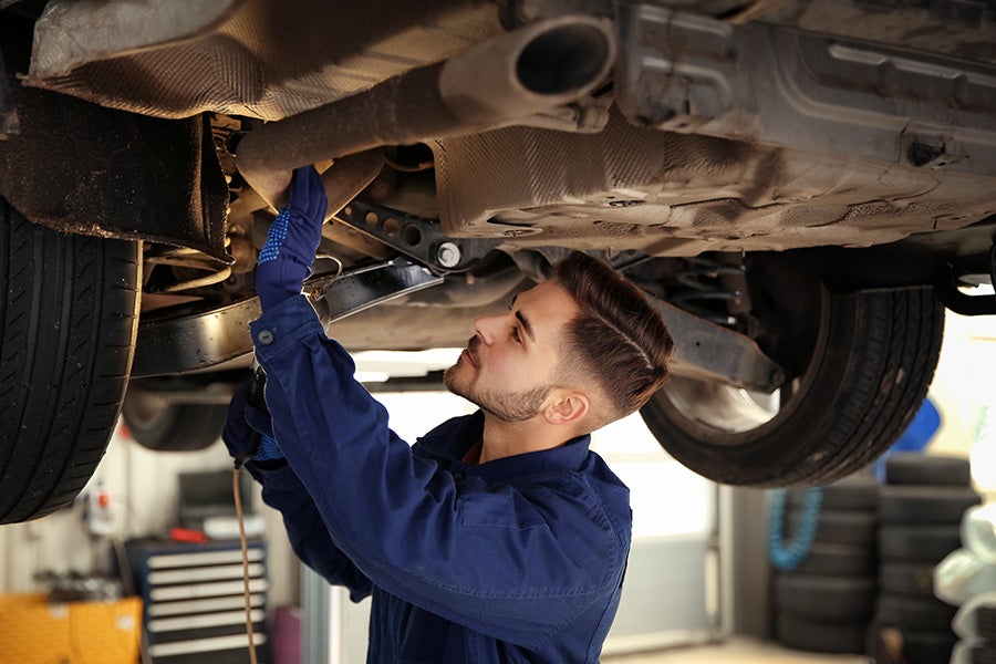 Service Technician Working on a Car